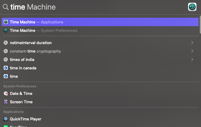 search for time machine application in the spotlight
